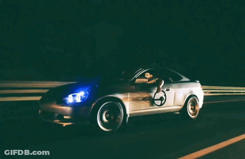 A Car With A Wheelchair On The Driver 'S Door GIF