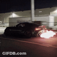 A Car With Flames Coming Out Of The Back GIF