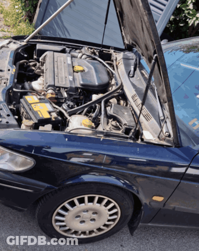 A Car With The Hood Open Has A Yellow Battery In It GIF