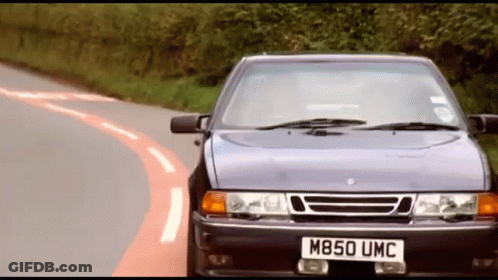 A Car With The License Plate M850 Umc Is Driving Down A Road GIF