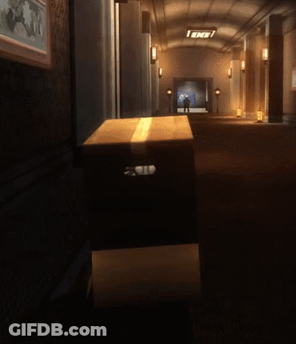A Cardboard Box In A Dark Hallway With A Sign That Says End GIF