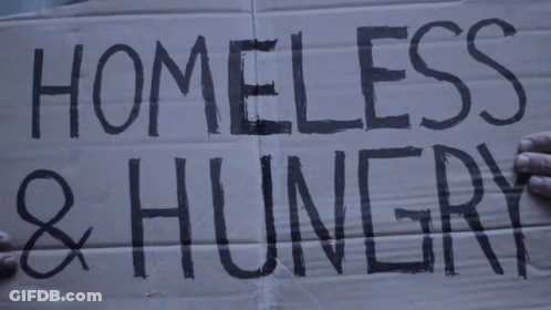 A Cardboard Sign That Says Homeless And Hungry GIF
