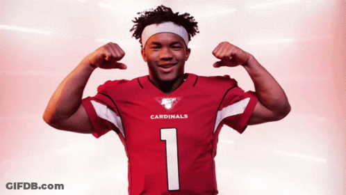 A Cardinals Player Flexes His Muscles In A Red Jersey GIF