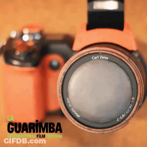 A Carl Zeiss Lens Is On A Camera With The Guarimba International Film Festival Written On The Bottom GIF