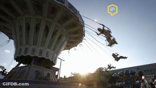 A Carnival Ride With A Yellow Speech Bubble That Says ' Ii ' On It GIF