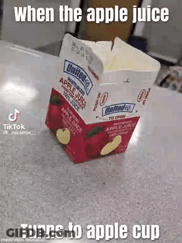 A Carton Of Apple Juice Is Sitting On A Table With A Caption That Says When The Apple Juice Turns To Apple Cup GIF
