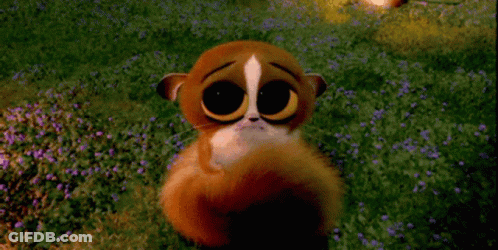 A Cartoon Animal Is Sitting In A Field Of Purple Flowers GIF