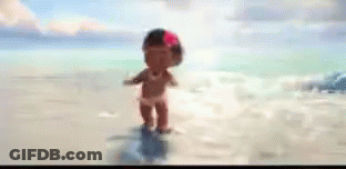 A Cartoon Baby Girl With A Flower In Her Hair Is Standing On A Beach . GIF