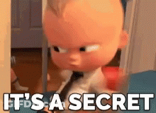 A Cartoon Baby Is Sitting In A Chair With The Words `` It 'S A Secret '' Written On It . GIF