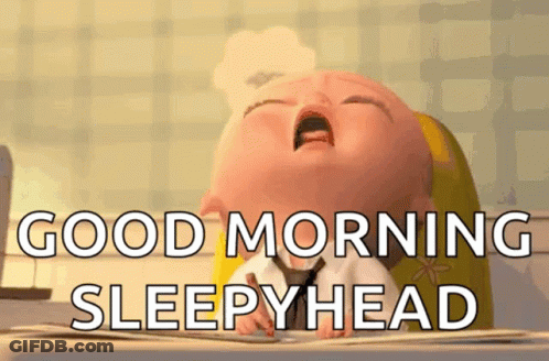 A Cartoon Baby Is Yawning And Says `` Good Morning Sleepyhead '' . GIF
