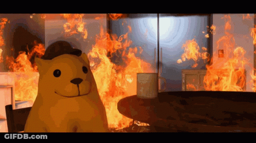 A Cartoon Bear Is Standing In Front Of A Fire GIF
