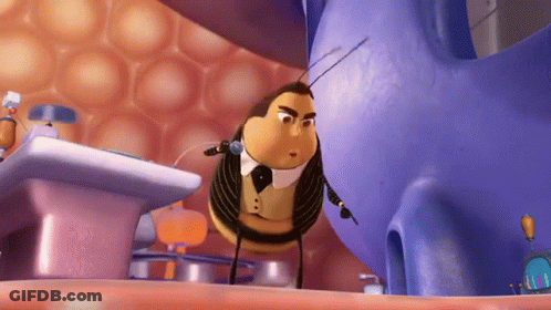 A Cartoon Bee Wearing A Tuxedo And Bow Tie Is Standing Next To A Purple Object GIF