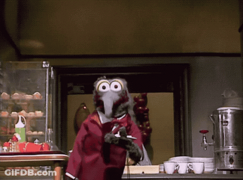 A Cartoon Bird Is Standing In Front Of A Display Of Eggs GIF