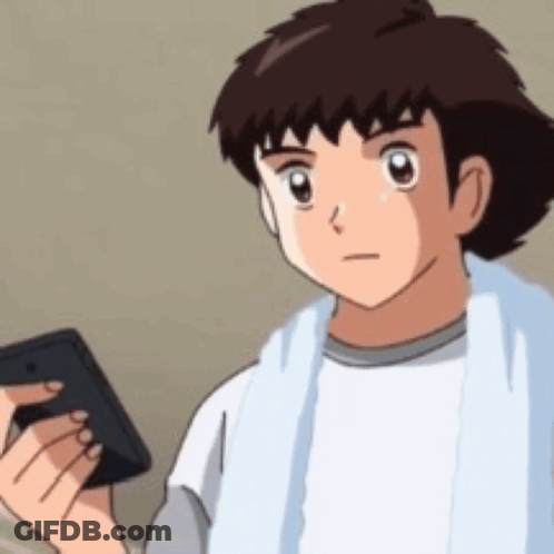 A Cartoon Boy Is Holding A Cell Phone In His Hand . GIF