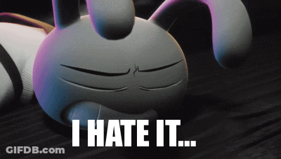A Cartoon Bunny Is Laying On The Floor With The Words " I Hate It " Below It GIF