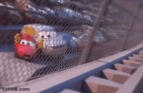 A Cartoon Car Is Driving Down A Roller Coaster Track . GIF