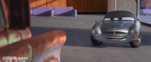 A Cartoon Car Is Sitting In A Room Next To A Couch And A Chair . GIF