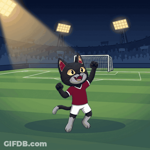 A Cartoon Cat In A Red Shirt And White Shorts Is Standing On A Soccer Field GIF