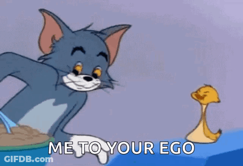 A Cartoon Cat Is Holding A Spoon In Front Of A Duck . GIF
