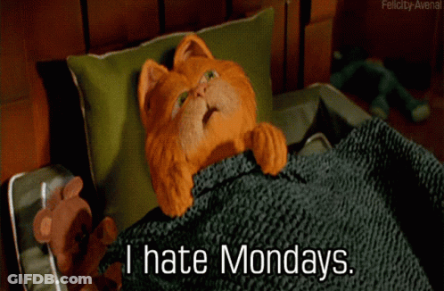 A Cartoon Cat Is Laying In Bed With The Words " I Hate Mondays " Below It GIF