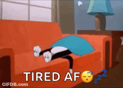 A Cartoon Cat Is Laying On A Couch With The Words Tired Af Written Above It . GIF