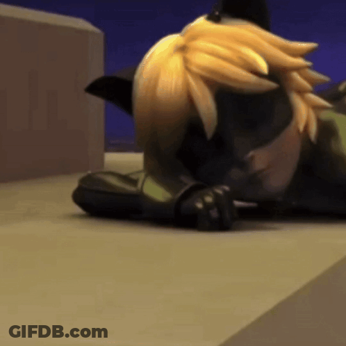 A Cartoon Cat Is Laying On The Ground With His Head On His Paws . GIF