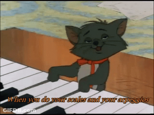 A Cartoon Cat Is Playing A Piano With The Words When You Do Your Scales And Your Arpeggios GIF