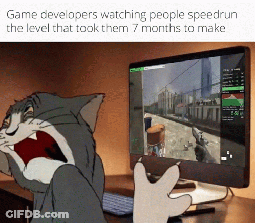 A Cartoon Cat Is Playing A Video Game On A Computer Monitor GIF