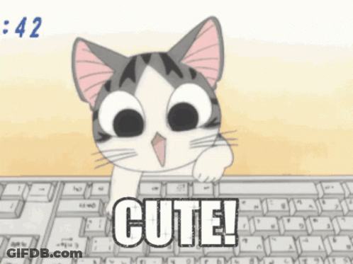 A Cartoon Cat Is Sitting At A Keyboard With The Word Cute Written On It GIF
