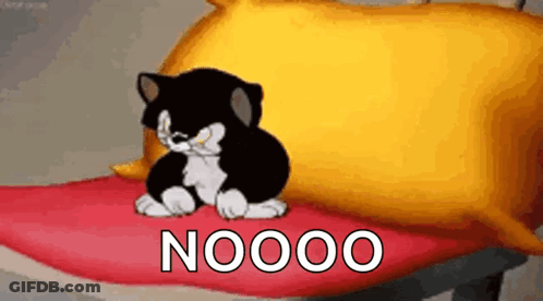 A Cartoon Cat Is Sitting On A Bed Next To A Pillow . GIF