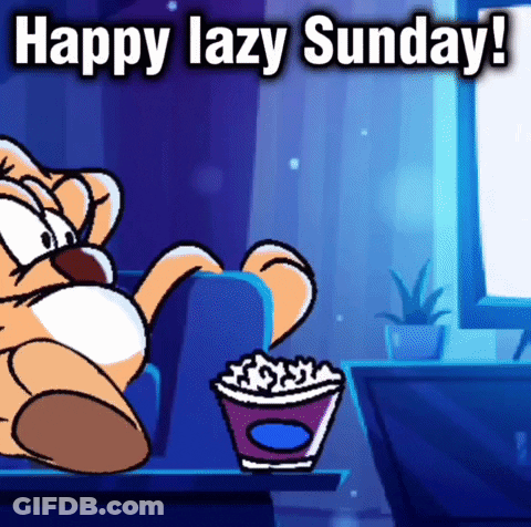 A Cartoon Cat Is Sitting On A Couch With A Cup Of Popcorn . GIF
