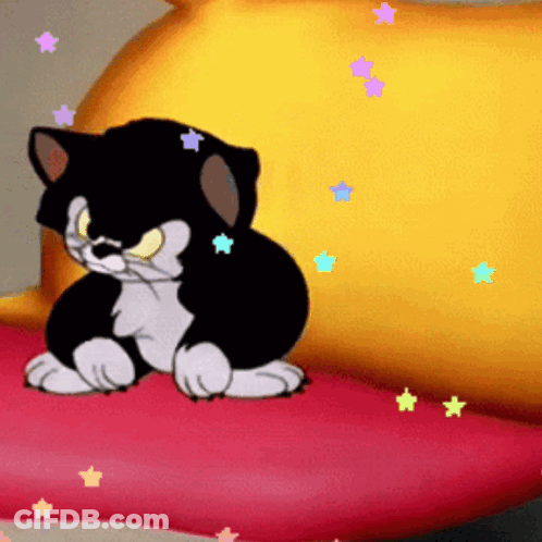 A Cartoon Cat Is Sitting On A Red Pillow GIF