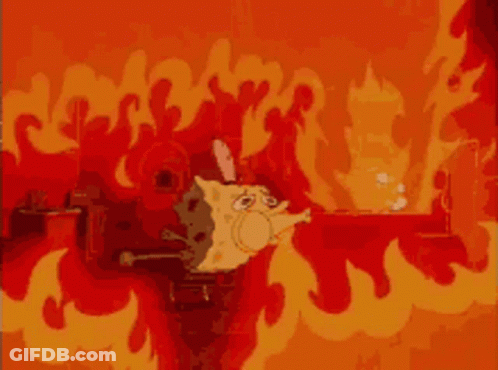 A Cartoon Cat Is Surrounded By Flames In A Fire Scene GIF
