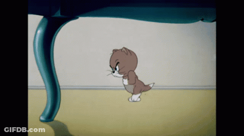 A Cartoon Cat Is Walking Under A Blue Table GIF