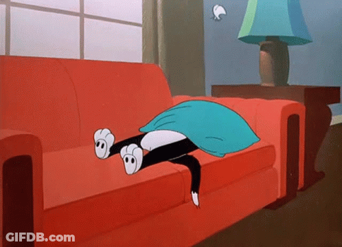 A Cartoon Cat Laying On A Red Couch With A Blue Pillow GIF