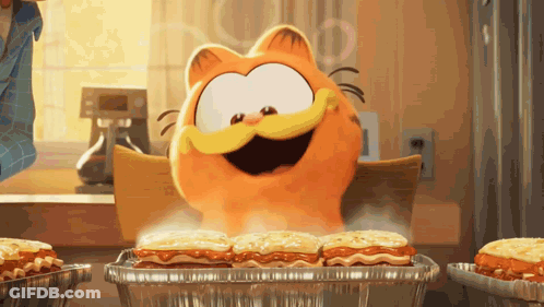 A Cartoon Cat Named Garfield Is Sitting At A Table Eating Lasagna GIF