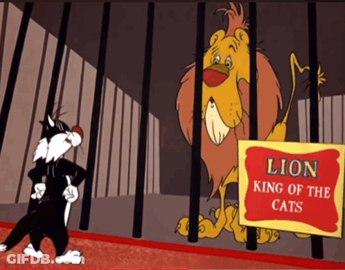 A Cartoon Cat Stands In Front Of A Lion In A Cage GIF