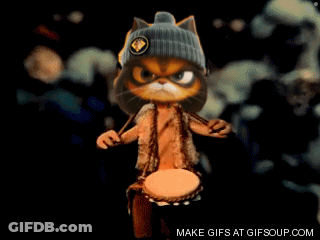 A Cartoon Cat Wearing A Hat Is Playing A Drum And Says Make Gifs At Gifsoup.com On The Bottom GIF