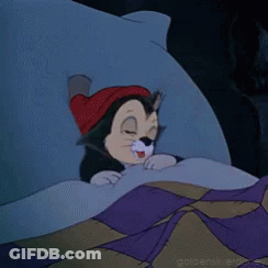 A Cartoon Cat Wearing A Red Hat Is Sleeping In Bed . GIF