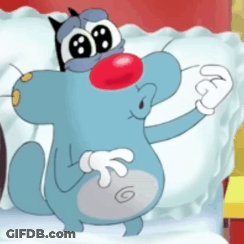 A Cartoon Cat With A Red Nose Is Standing Next To A Bed . GIF