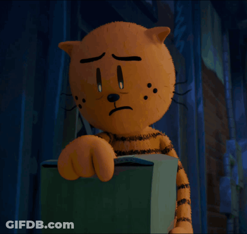 A Cartoon Cat With A Sad Look On His Face Is Holding A Box GIF
