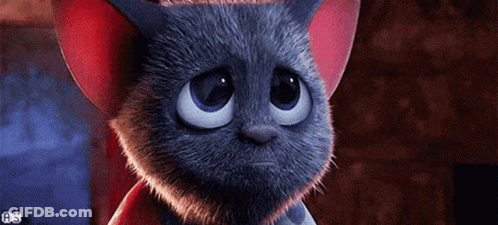 A Cartoon Cat With A Sad Look On Its Face Is Wearing A Red Hat . GIF