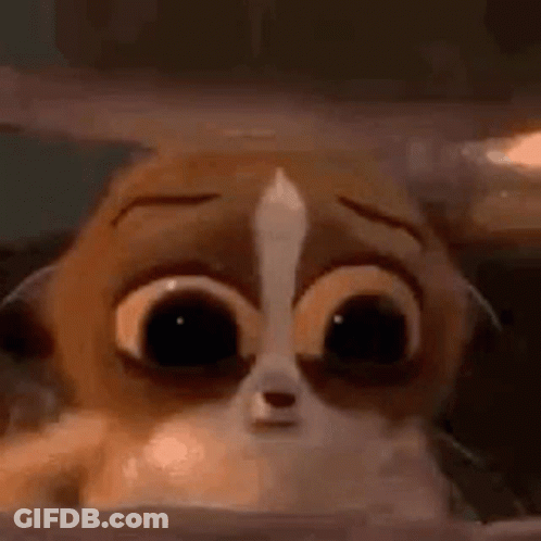 A Cartoon Cat With Big Eyes Is Looking Out Of A Box . GIF