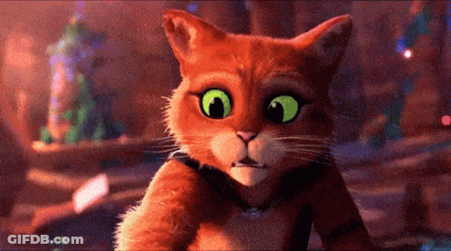 A Cartoon Cat With Green Eyes Looking At The Camera GIF