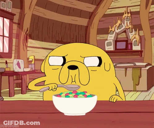 A Cartoon Character From Adventure Time Is Eating A Bowl Of Cereal With A Spoon GIF