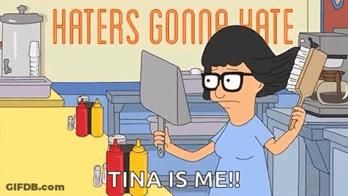 A Cartoon Character From Bob 'S Burgers Is Holding A Brush And A Laptop Computer In A Kitchen . GIF