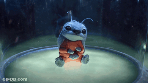 A Cartoon Character From Disney Enterprises Inc. Is Sitting In A Glass Container GIF