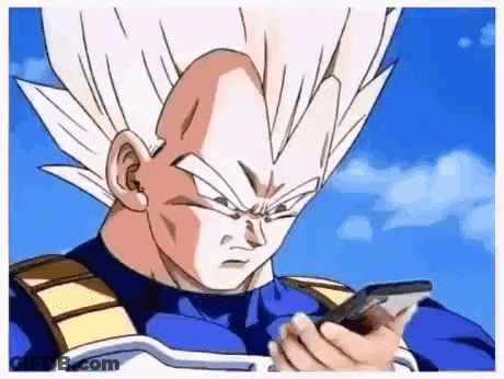 A Cartoon Character From Dragon Ball Z Is Holding A Cell Phone In His Hand . GIF