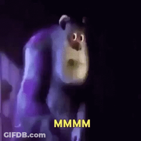 A Cartoon Character From Monsters Inc Is Standing In The Dark With The Word Mmmm Written On The Bottom . GIF