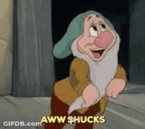 A Cartoon Character From Snow White And The Seven Dwarfs Is Standing In Front Of A Wall And Laughing . GIF